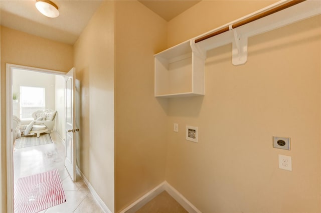 1610 Mason Knights Dr, Katy, TX 77493 - laundry room featuring washer hookup, electric dryer hookup, light tile patterned flooring, and baseboards
