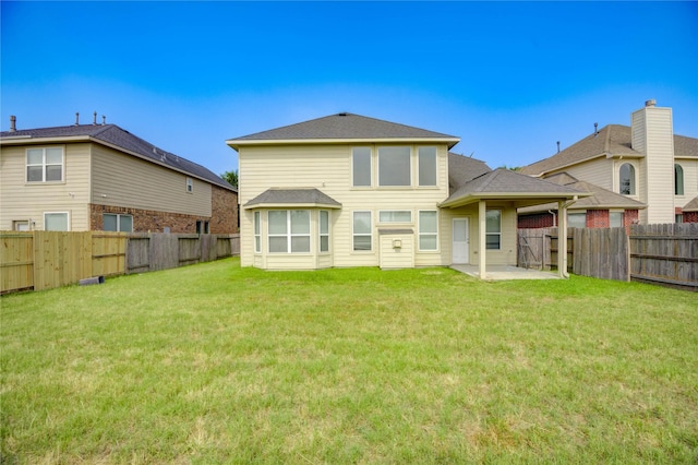 1610 Mason Knights Dr, Katy, TX 77493 - back of property featuring a patio area and a shingled roof