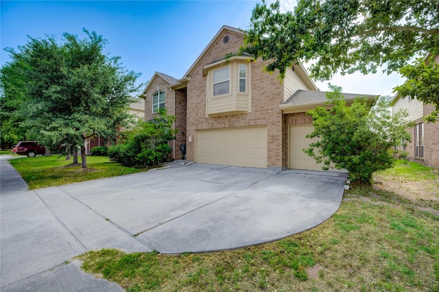 1610 Mason Knights Dr, Katy, TX 77493 - view of front of property featuring driveway, a garage, brick siding, and a front lawn