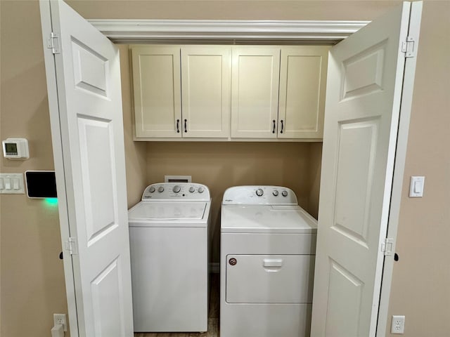 534 Oakdale Dr, Huntsville, TX 77320 - washroom with washer and dryer and cabinet space