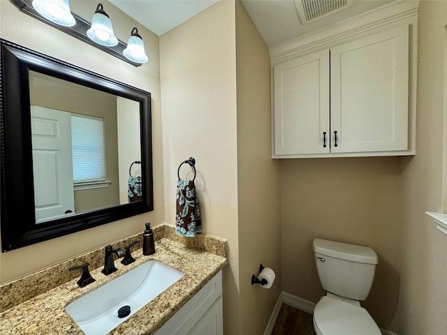 534 Oakdale Dr, Huntsville, TX 77320 - half bath with toilet, baseboards, and vanity