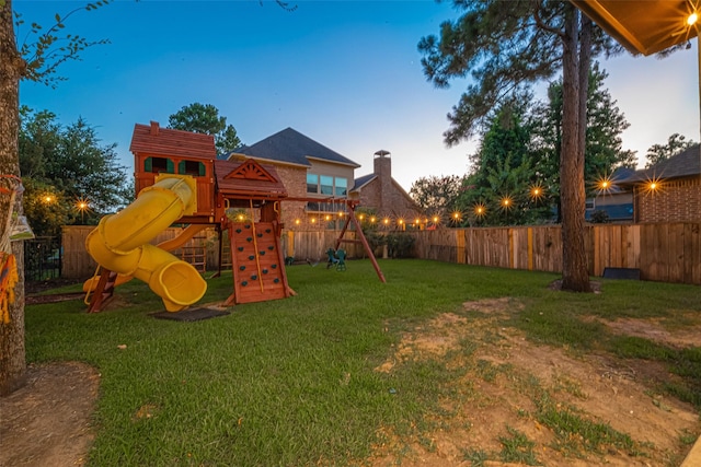 105 Checkerbloom Ct, Montgomery, TX 77316 - playground at dusk featuring a playground