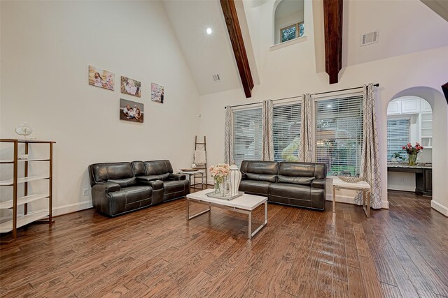 105 Checkerbloom Ct, Montgomery, TX 77316 - living room with high vaulted ceiling, wood finished floors, arched walkways, beam ceiling, and healthy amount of natural light