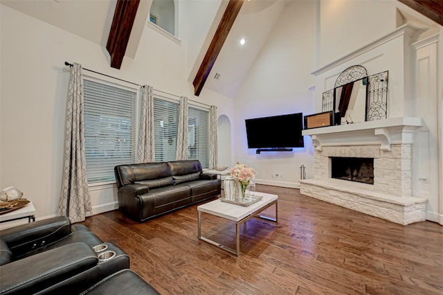 105 Checkerbloom Ct, Montgomery, TX 77316 - living room with high vaulted ceiling, wood finished floors, beam ceiling, baseboards, and a fireplace