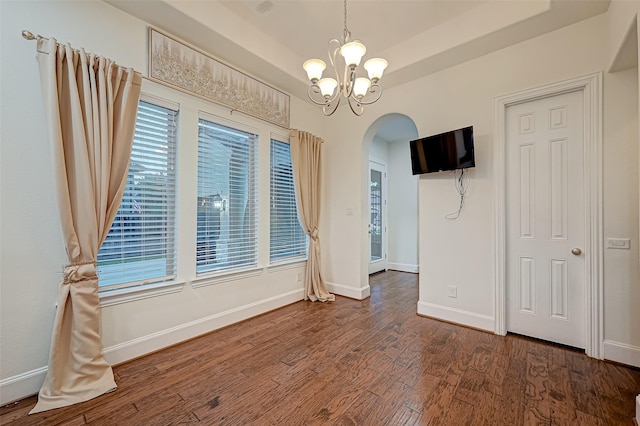 105 Checkerbloom Ct, Montgomery, TX 77316 - spare room with arched walkways, wood finished floors, a chandelier, and baseboards
