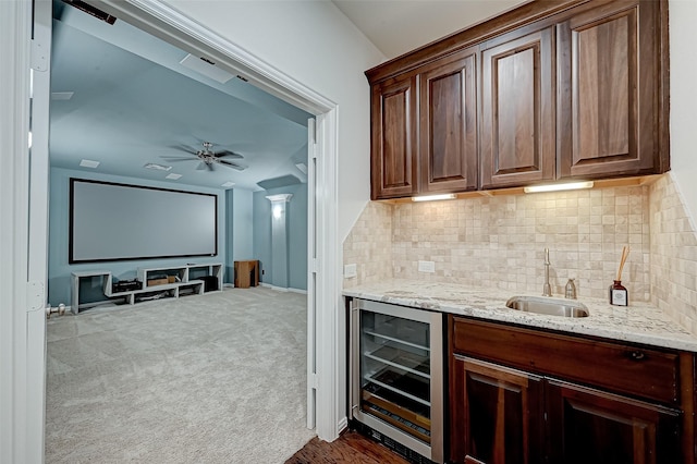 105 Checkerbloom Ct, Montgomery, TX 77316 - indoor wet bar with wine cooler, tasteful backsplash, ceiling fan, and dark carpet