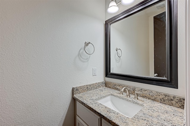 105 Checkerbloom Ct, Montgomery, TX 77316 - bathroom with vanity and a textured wall