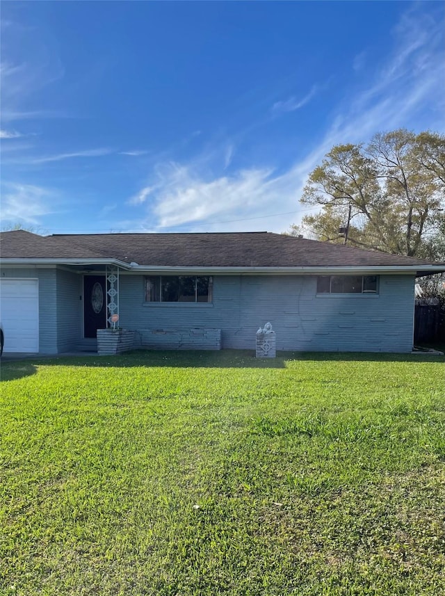 4015 42nd St, Port Arthur, TX 77642 - view of front of house featuring a garage and a front yard