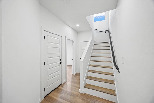 1216 E 34th St Unit B, Houston, TX 77022 - stairway featuring wood finished floors, recessed lighting, and baseboards