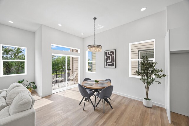 1216 E 34th St Unit B, Houston, TX 77022 - dining room featuring light wood finished floors, a chandelier, baseboards, and recessed lighting