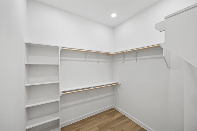 1216 E 34th St Unit B, Houston, TX 77022 - walk in closet featuring wood finished floors