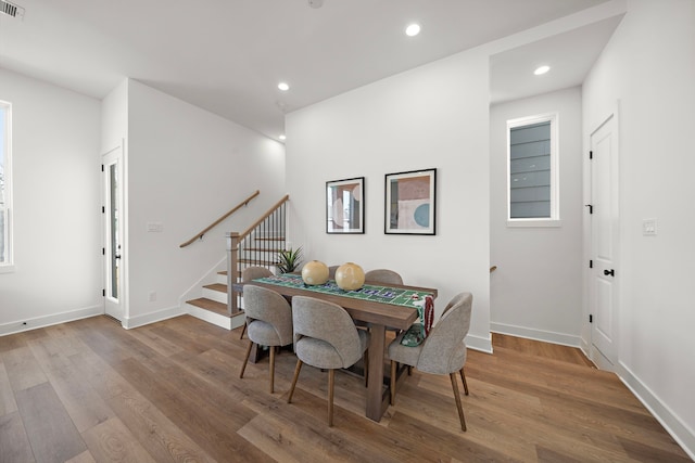 835 Elkhart St Unit A, Houston, TX 77091 - dining room with wood finished floors, stairway, recessed lighting, and baseboards