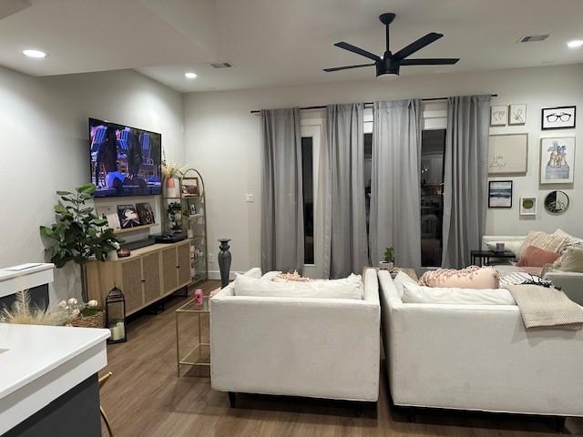 4816 Brinkman St, Houston, TX 77018 - living room featuring ceiling fan, wood finished floors, and recessed lighting