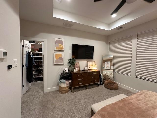 4816 Brinkman St, Houston, TX 77018 - bedroom with a spacious closet, a raised ceiling, carpet flooring, baseboards, and a closet