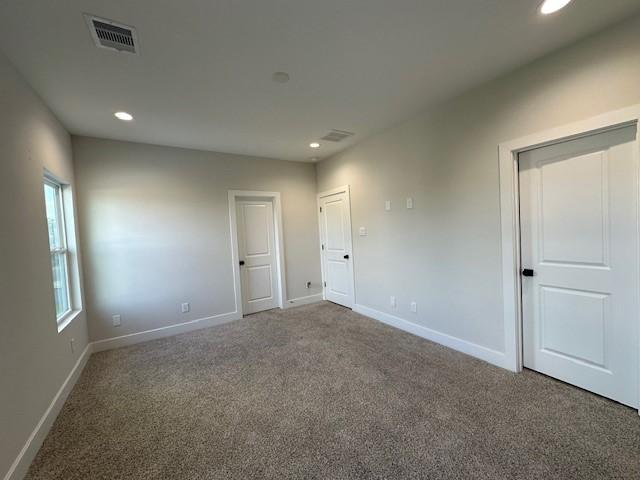 4816 Brinkman St, Houston, TX 77018 - unfurnished bedroom with carpet floors, recessed lighting, and baseboards