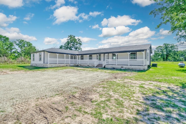 3508 Dick Barnes Loop, Bedias, TX 77831 - view of front of property featuring a porch, crawl space, and a front lawn