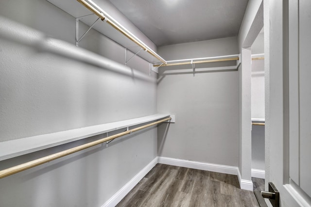 3508 Dick Barnes Loop, Bedias, TX 77831 - walk in closet featuring dark wood-type flooring
