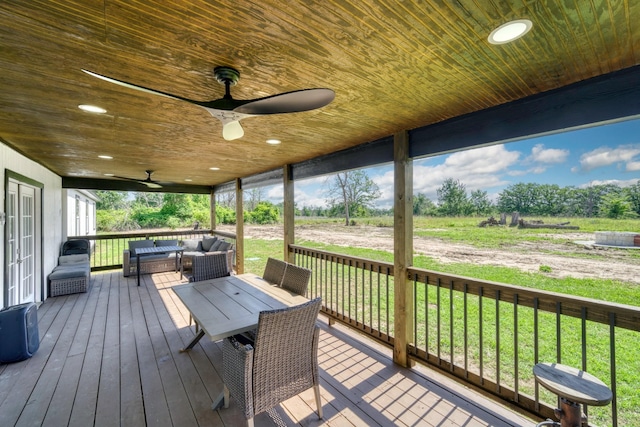 3508 Dick Barnes Loop, Bedias, TX 77831 - wooden terrace featuring an outdoor living space, a ceiling fan, and a lawn