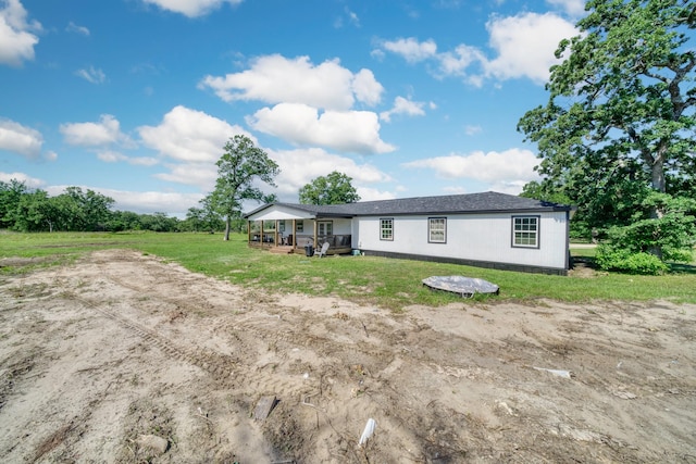 3508 Dick Barnes Loop, Bedias, TX 77831 - back of property featuring covered porch and a lawn