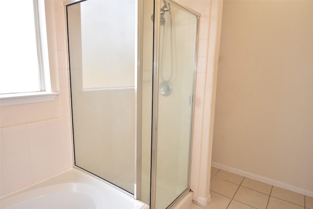 21031 Noelle Ct, Humble, TX 77338 - full bath featuring a shower stall, tile patterned flooring, a garden tub, and baseboards
