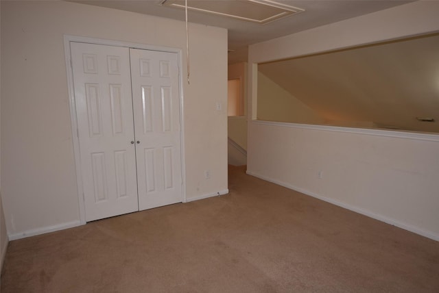 21031 Noelle Ct, Humble, TX 77338 - unfurnished bedroom with attic access, carpet floors, a closet, and baseboards