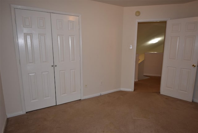 21031 Noelle Ct, Humble, TX 77338 - unfurnished bedroom featuring carpet, a closet, and baseboards