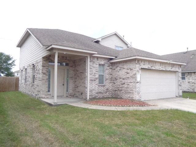 21031 Noelle Ct, Humble, TX 77338 - ranch-style house with a garage, concrete driveway, and brick siding