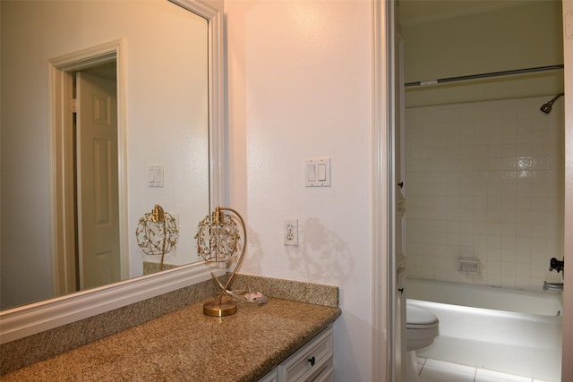 bathroom featuring toilet, vanity, and shower / tub combination