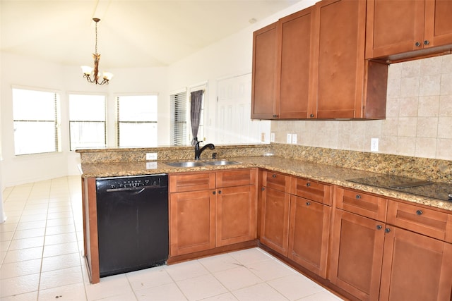 kitchen featuring black appliances, a sink, a peninsula, light stone counters, and a chandelier