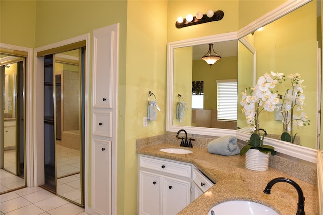 full bathroom featuring tile patterned flooring and double vanity