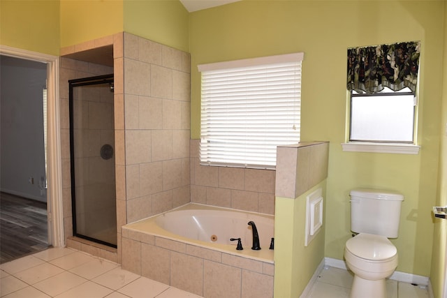 full bathroom featuring a shower stall, healthy amount of natural light, and a tub with jets