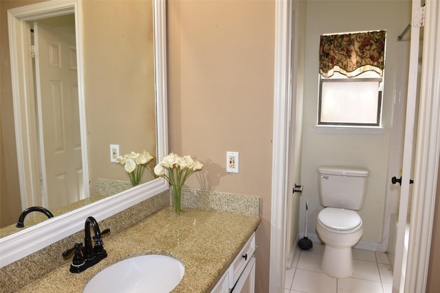 bathroom with vanity, toilet, and tile patterned flooring