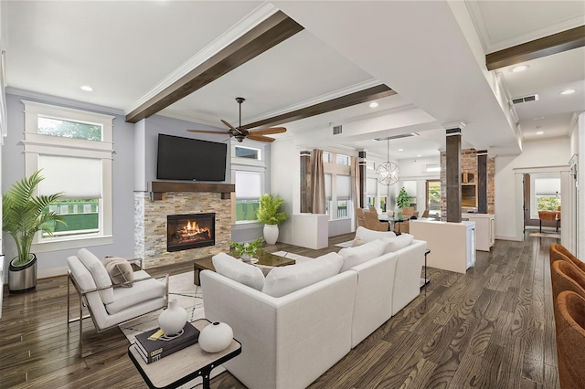 1202 Archer St, Houston, TX 77009 - living room featuring a ceiling fan, a fireplace, dark wood-style floors, healthy amount of natural light, and crown molding