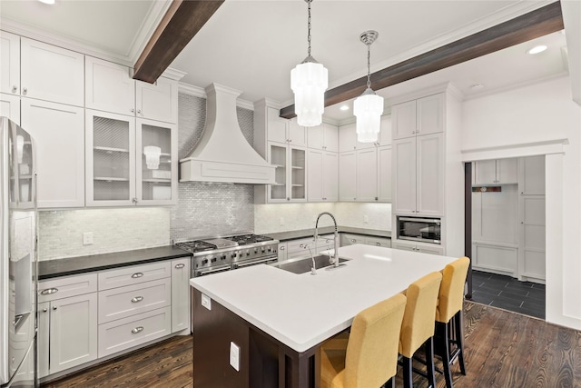 1202 Archer St, Houston, TX 77009 - kitchen featuring stainless steel appliances, ornamental molding, custom exhaust hood, a sink, and a breakfast bar