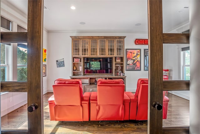 1202 Archer St, Houston, TX 77009 - cinema room featuring ornamental molding, wood finished floors, baseboards, and recessed lighting