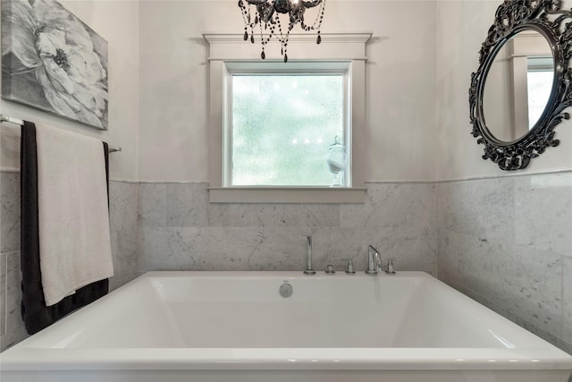 1202 Archer St, Houston, TX 77009 - full bathroom with a tub, healthy amount of natural light, and a chandelier