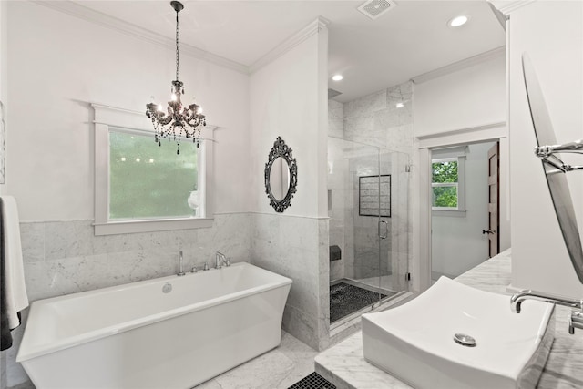 1202 Archer St, Houston, TX 77009 - bathroom with crown molding, a soaking tub, a chandelier, a stall shower, and a sink