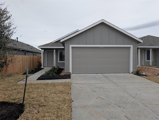 12519 Mountain Daisy Rd, Houston, TX 77038 - ranch-style house with a garage, driveway, and board and batten siding