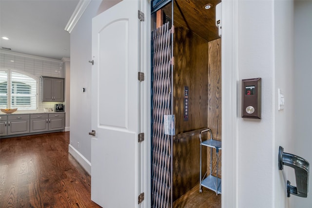 856 Dunleigh Meadows Ln, Houston, TX 77055 - hall featuring dark wood-style flooring, baseboards, and crown molding