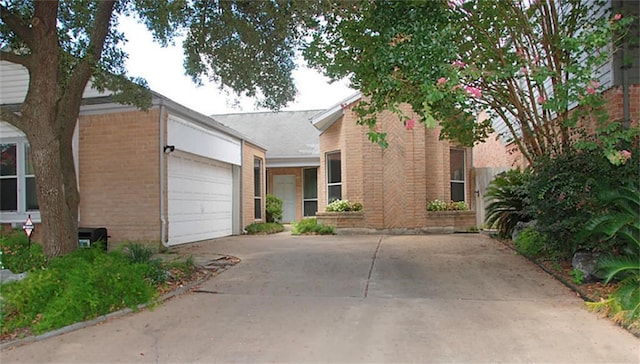 2118 Linea Del Pino St, Houston, TX 77077 - view of front of home with brick siding, an attached garage, and concrete driveway