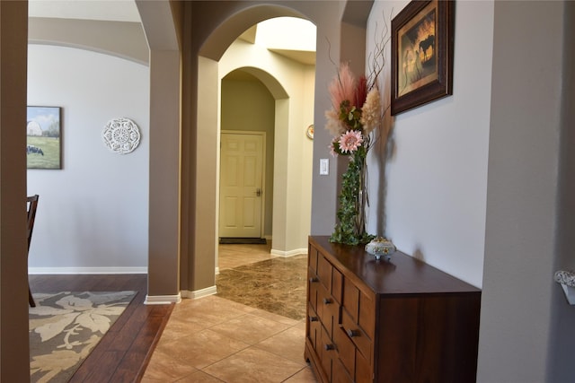 2603 Briar Rose Ct, Pearland, TX 77584 - corridor with arched walkways, baseboards, and light wood finished floors