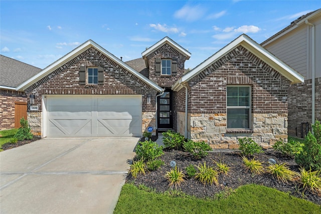 208 Catalina Cove Dr, Katy, TX 77493 - view of front of house with concrete driveway, a garage, stone siding, and brick siding