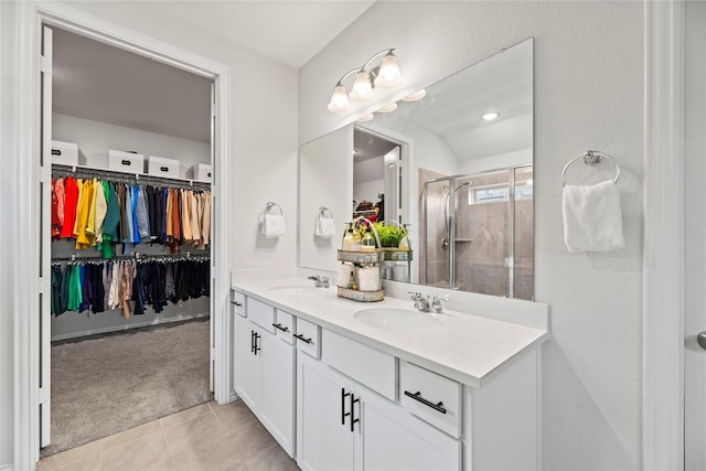 208 Catalina Cove Dr, Katy, TX 77493 - full bath with a spacious closet, a stall shower, double vanity, and tile patterned flooring