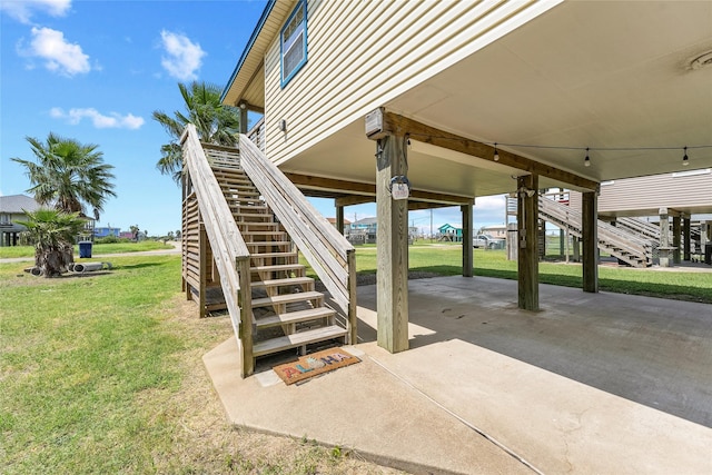 424 Angel Wing St, Surfside Beach, TX 77541 - view of patio / terrace featuring stairs and a carport