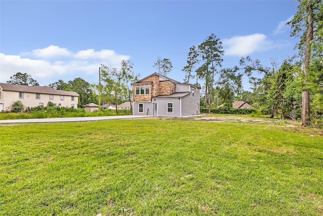 18586 Summer Hills Blvd, Porter, TX 77365 - view of side of property with a yard and stone siding