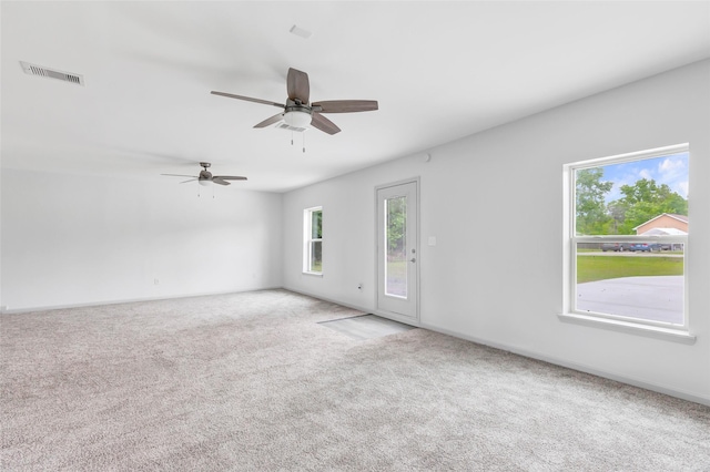 18586 Summer Hills Blvd, Porter, TX 77365 - unfurnished room featuring carpet flooring, healthy amount of natural light, ceiling fan, and baseboards