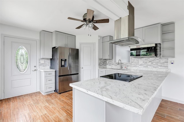 18586 Summer Hills Blvd, Porter, TX 77365 - kitchen with appliances with stainless steel finishes, island range hood, a sink, a peninsula, and ceiling fan