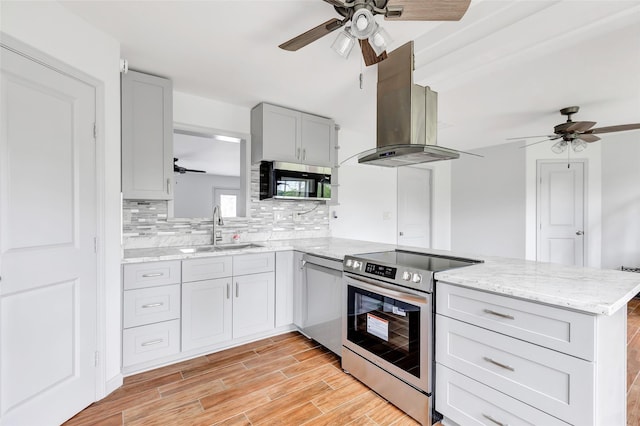 18586 Summer Hills Blvd, Porter, TX 77365 - kitchen with a ceiling fan, stainless steel appliances, a sink, and island exhaust hood