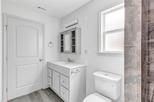 18586 Summer Hills Blvd, Porter, TX 77365 - bathroom with toilet, vanity, and wood finished floors