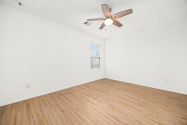 4347 Palmetto Grove Ln, Baytown, TX 77521 - spare room featuring light wood finished floors, baseboards, and ceiling fan